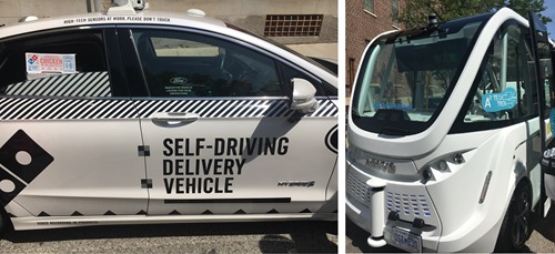Two of the Tech Trek's self driving vehicles, including pizza delivery!