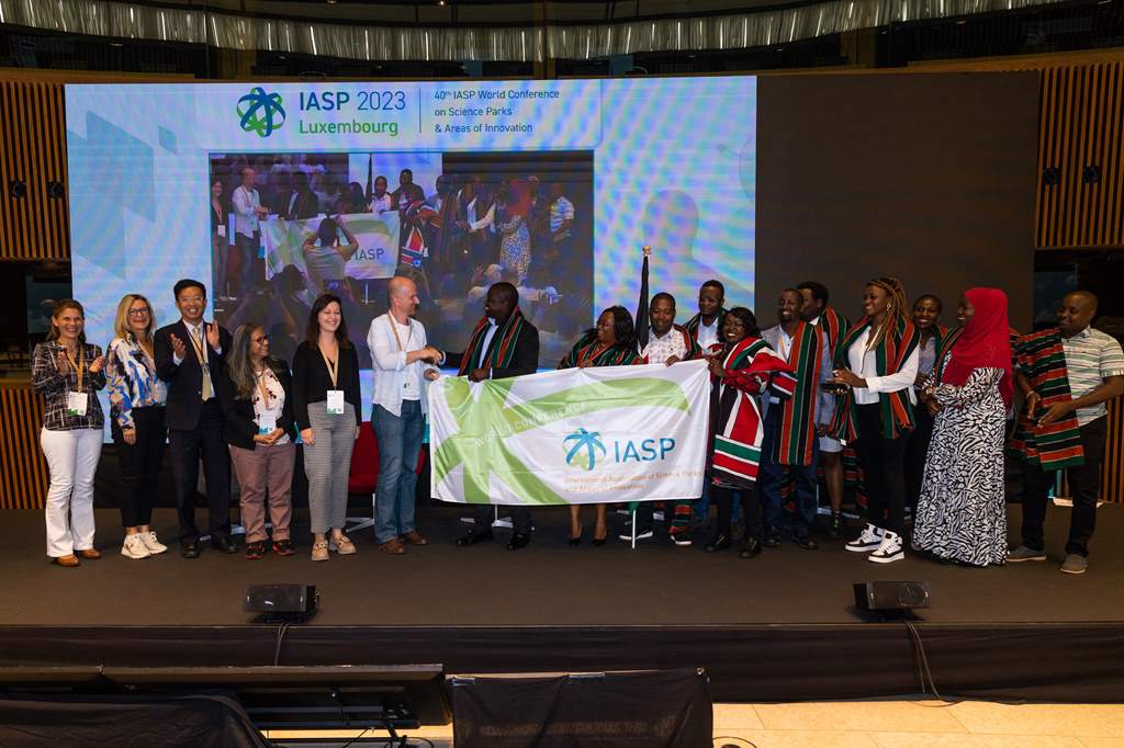 IASP 2023 host Technoport passing the IASP Wold Conference flag to next year's host, Konza Technopolis
