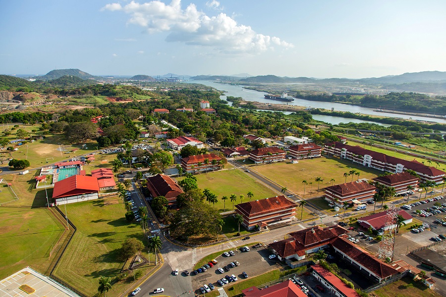 An aerial view of the City of Knowledge with the Panama Canal in the background
