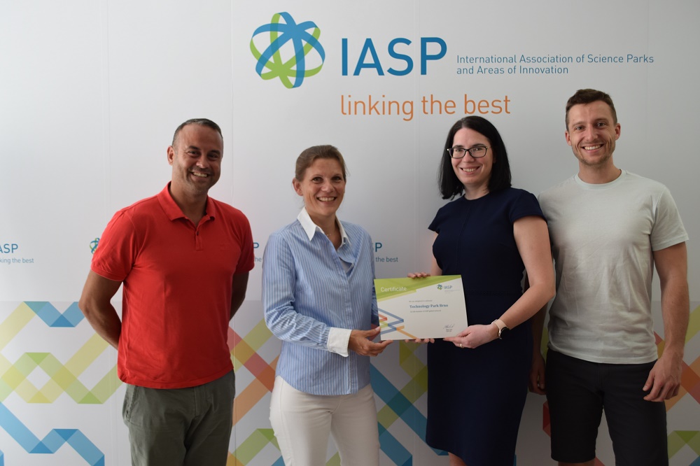 The Brno management team collect their membership certificate from IASP CEO Ebba Lund