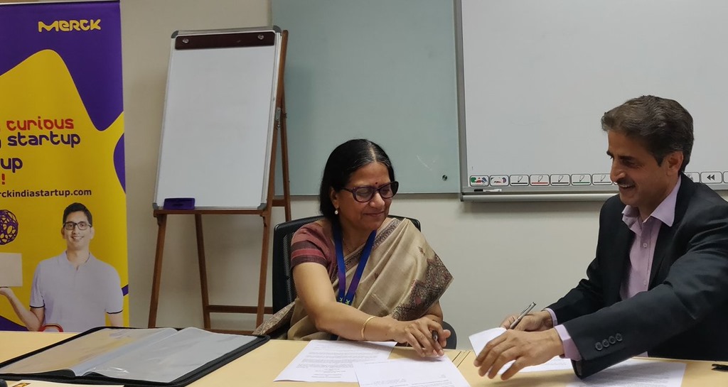 IKP CEO Deepanwita Chattopadhyay signs the MoU with Merck's Sunil Punjabi