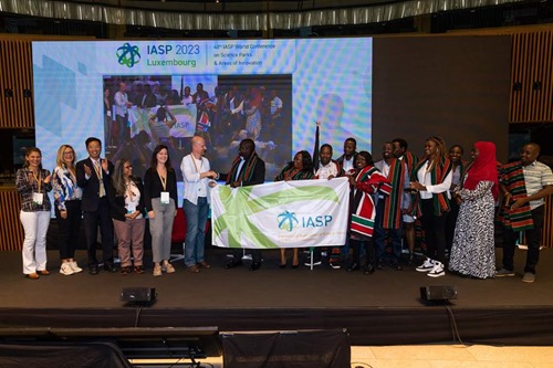 IASP 2023 host Technoport passing the IASP Wold Conference flag to next year's host, Konza Technopolis
