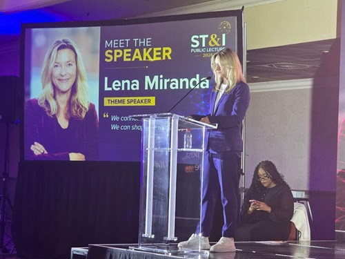 Lena Miranda giving a speech at ST&I event